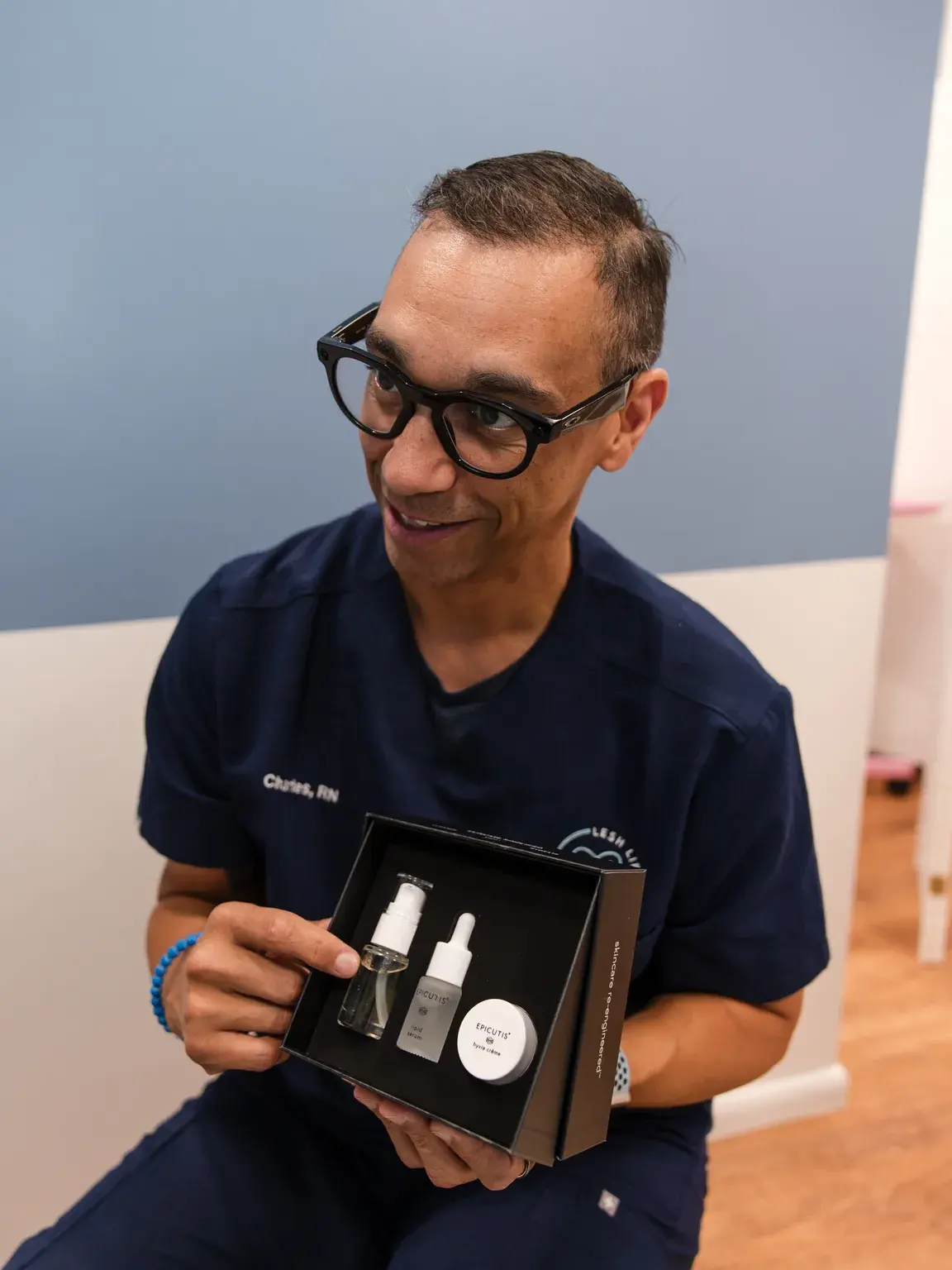 Charles, RN holding an Epicutis skincare set at Lesh Lifestyle