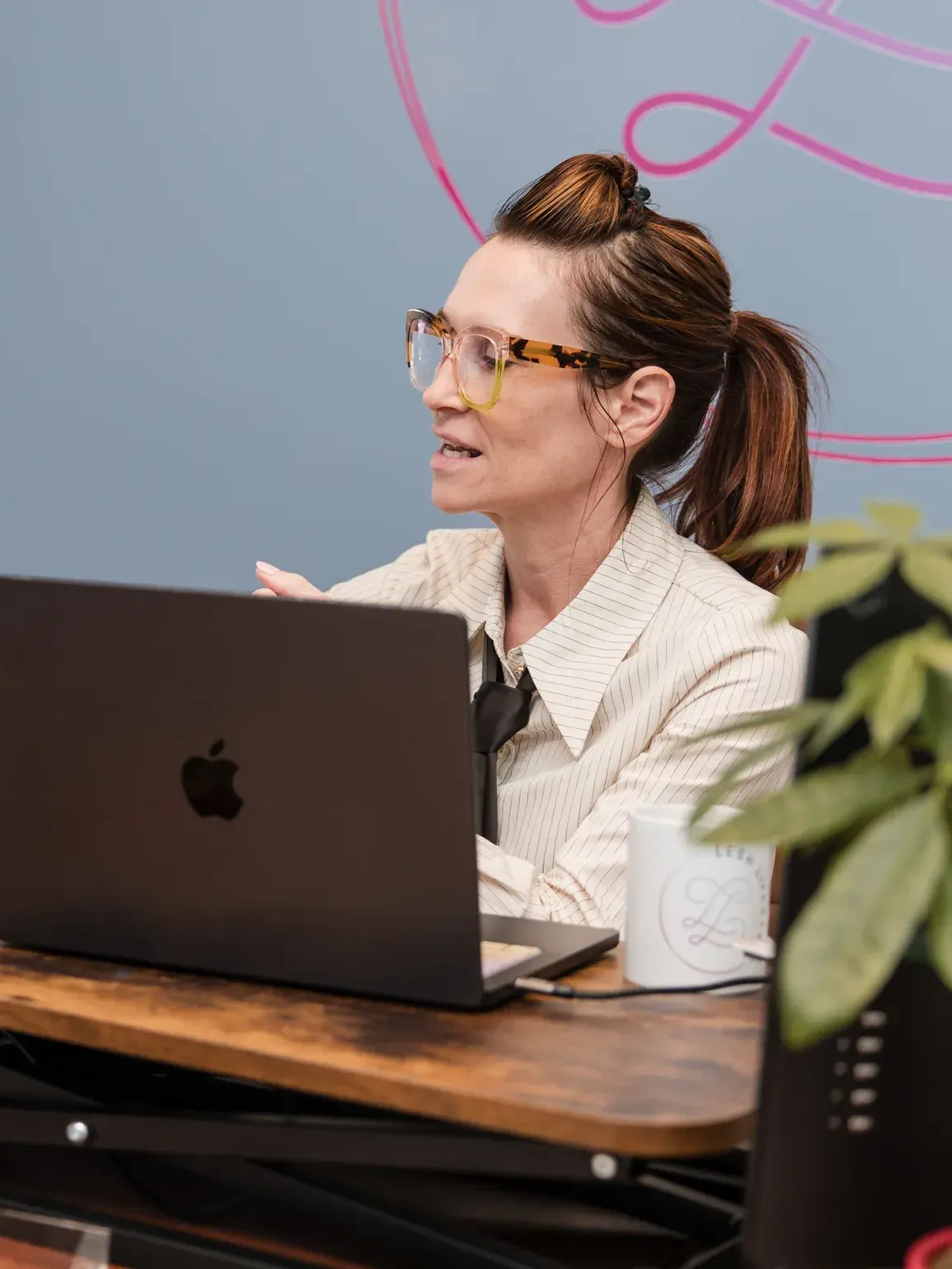 Dr. Sarah reviewing hormone education material at her desk