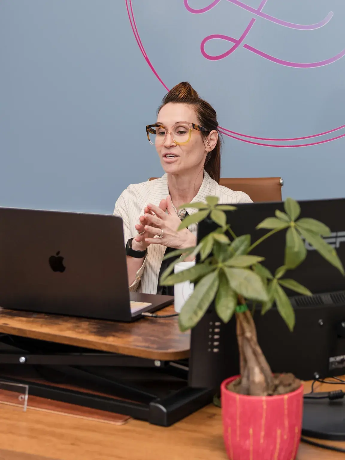 Dr. Sarah Secor-Jones at her desk at Lesh Lifestyle in Sarasota