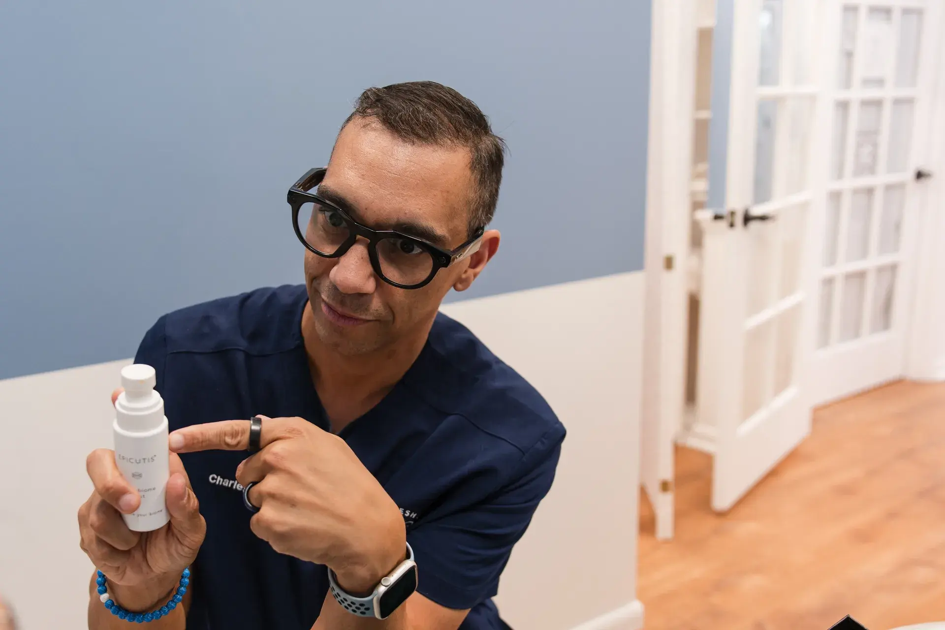 Charles Jones, RN, explaining Epicutis skincare at Lesh Lifestyle