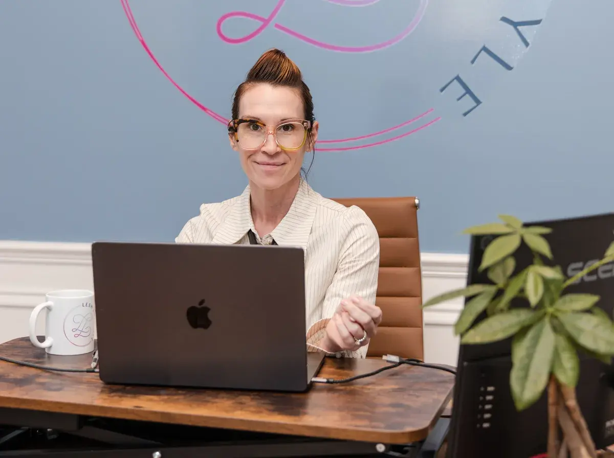 Dr. Sarah working at her desk at Lesh Lifestyle