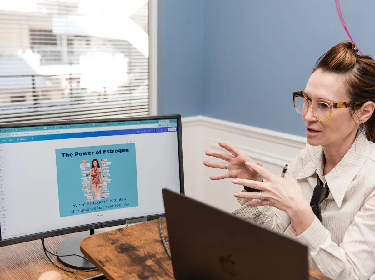 Dr. Sarah at her desk at Lesh Lifestyle