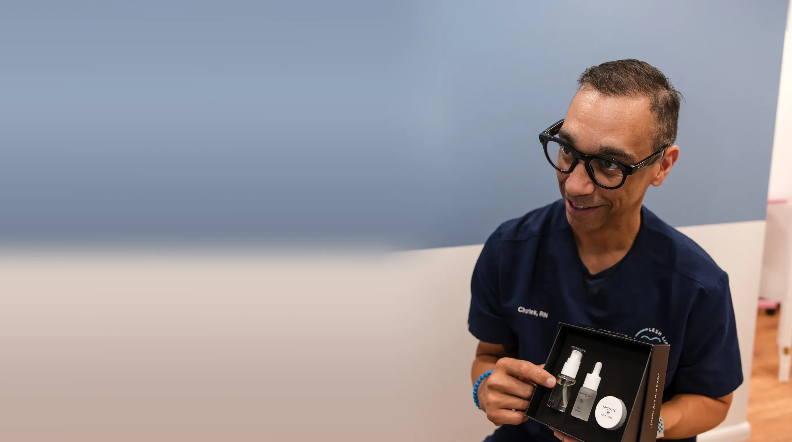 Charles, RN holding an Epicutis skincare set at Lesh Lifestyle