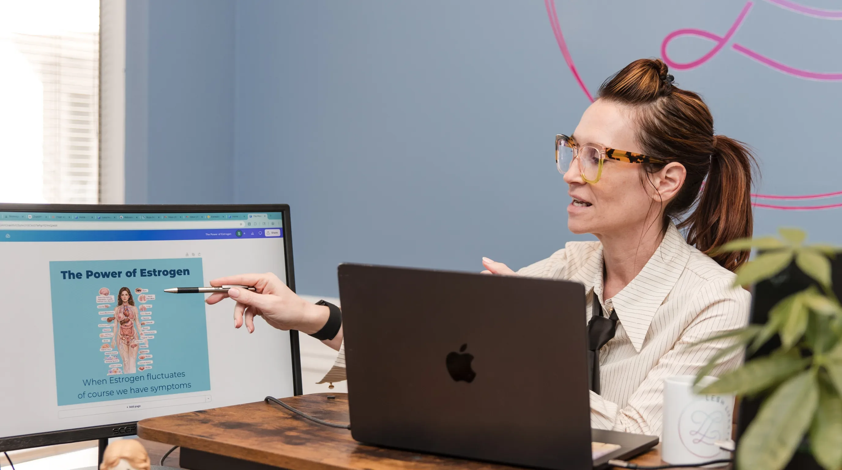 Dr. Sarah reviewing hormone education material at her desk