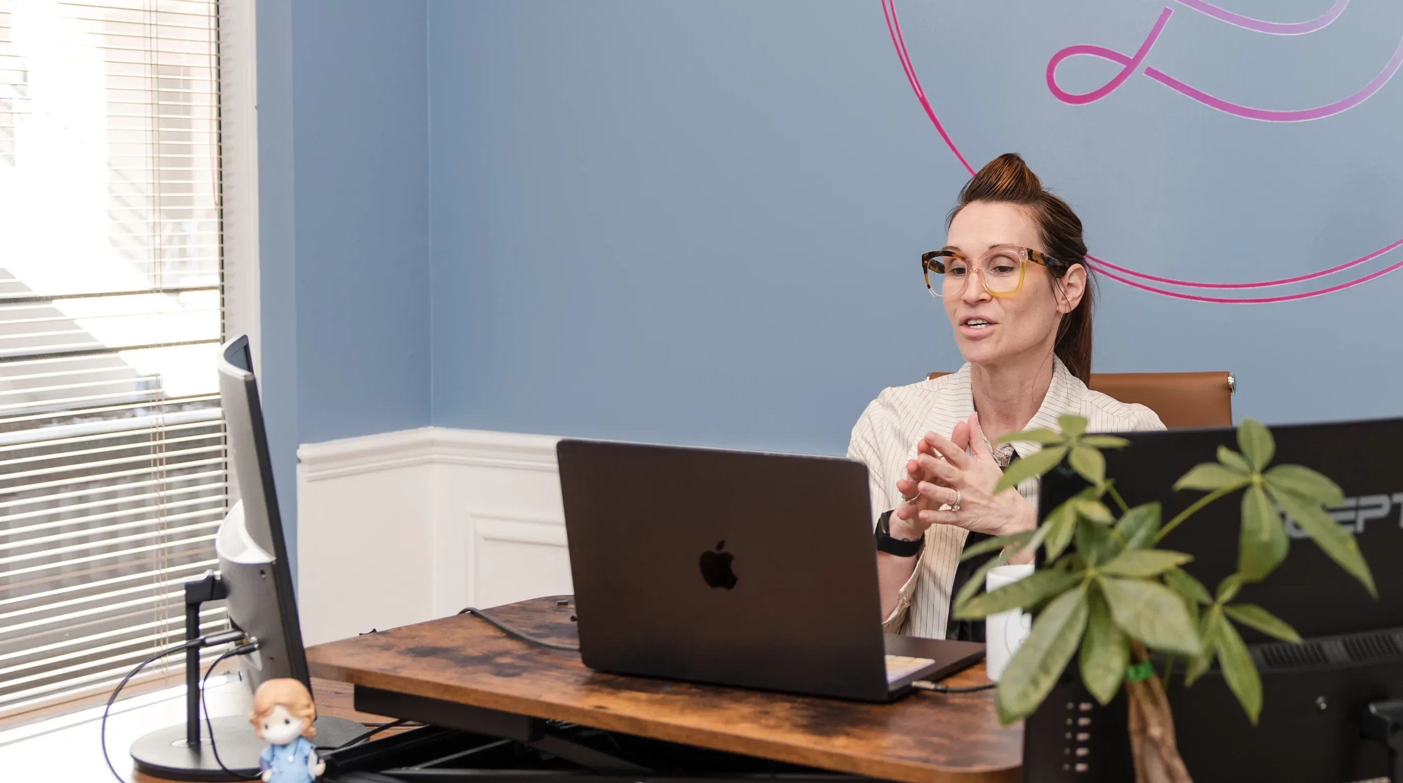 Dr. Sarah Secor-Jones at her desk at Lesh Lifestyle in Sarasota
