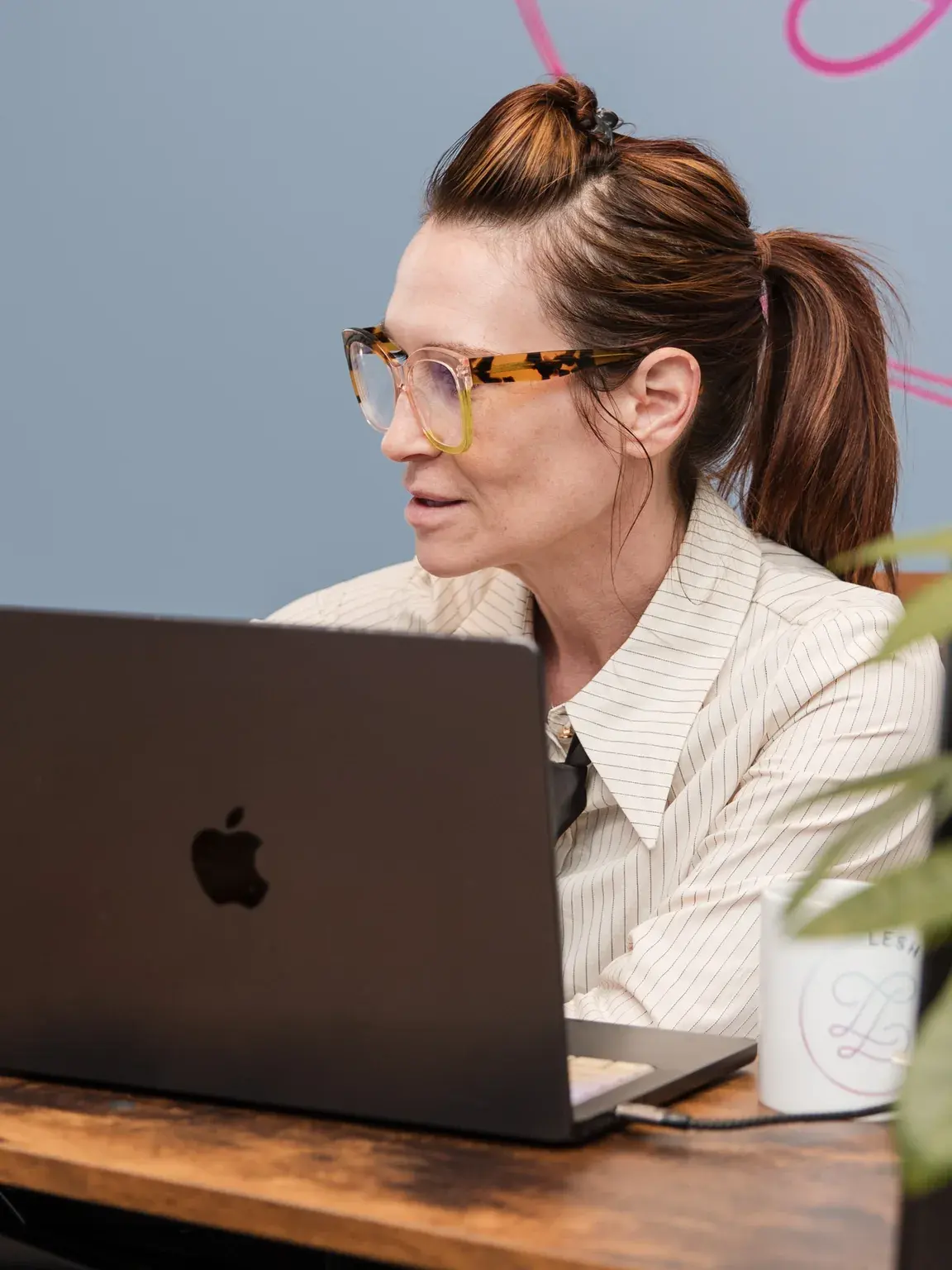 Dr. Sarah reviewing a menopause education slide at her desk