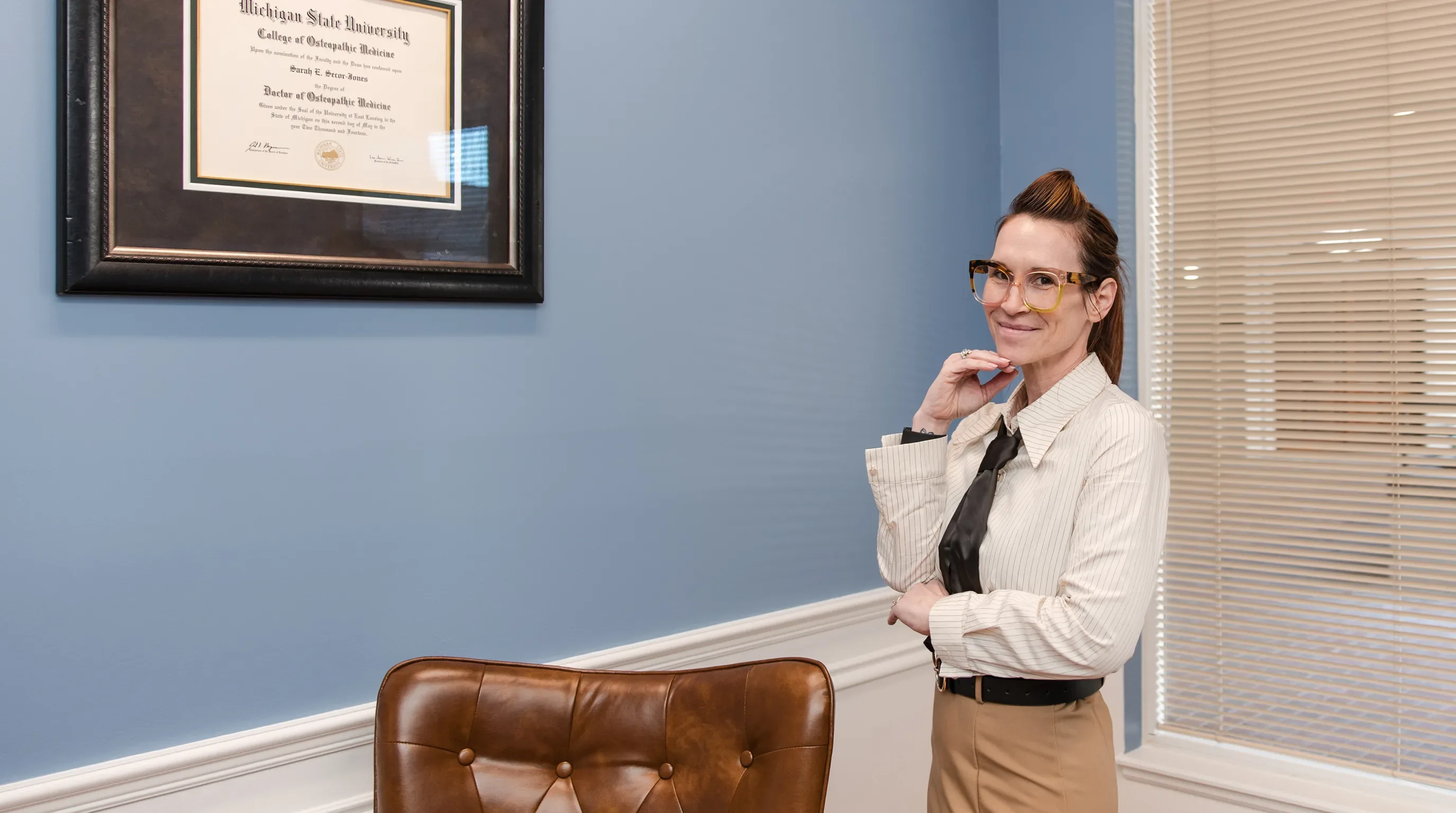 Dr. Sarah Secor-Jones standing in her office at Lesh Lifestyle