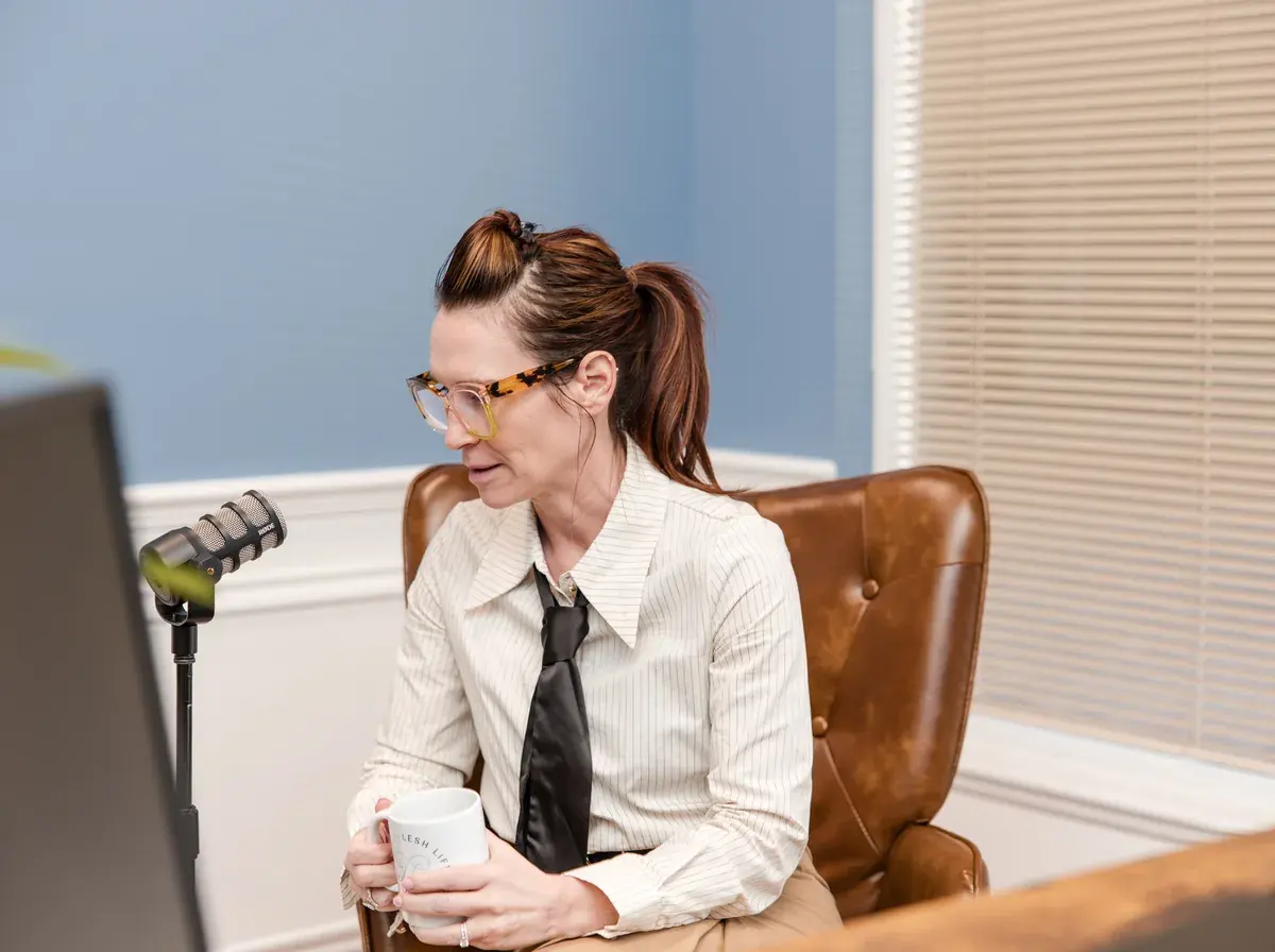 Dr. Sarah Secor-Jones seated in her office at Lesh Lifestyle